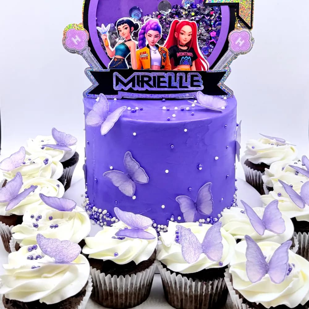 Purple cake with lilac butterflies and a K-Pop Demon Hunters topper for Mirelle, with matching butterfly cupcakes
